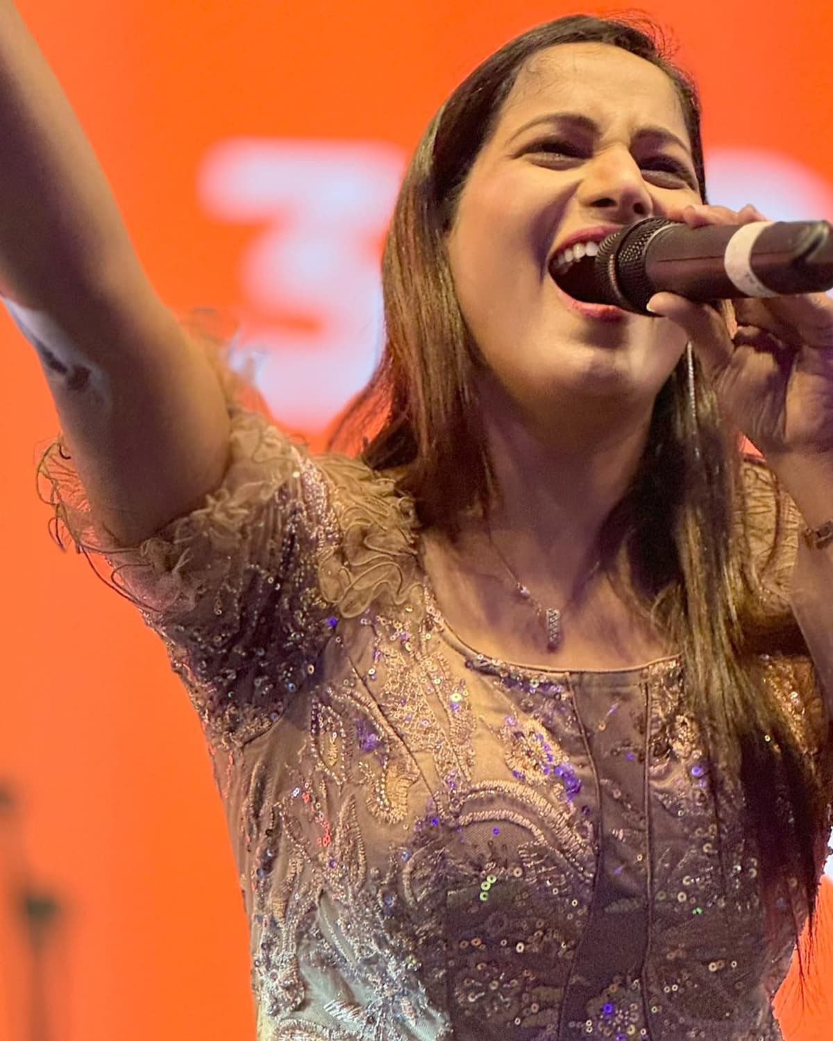 Kkomal Krusshna performing at corporate event