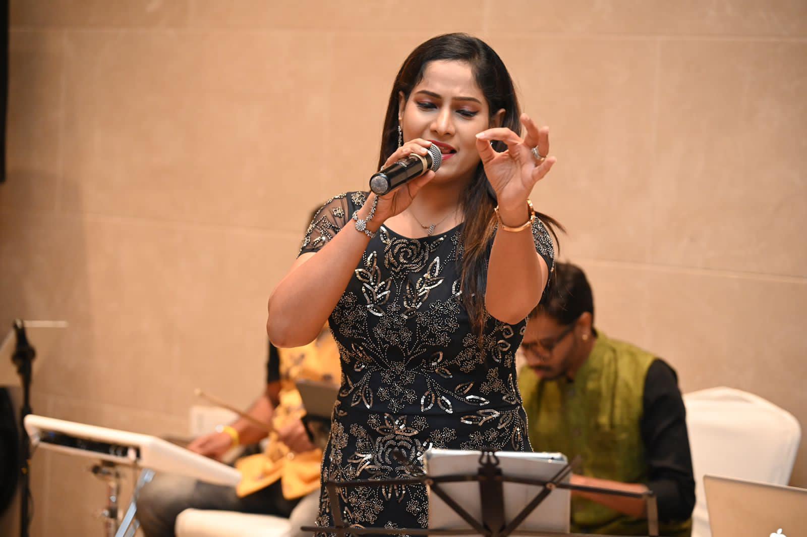 Kkomal Krusshna stage performance with band